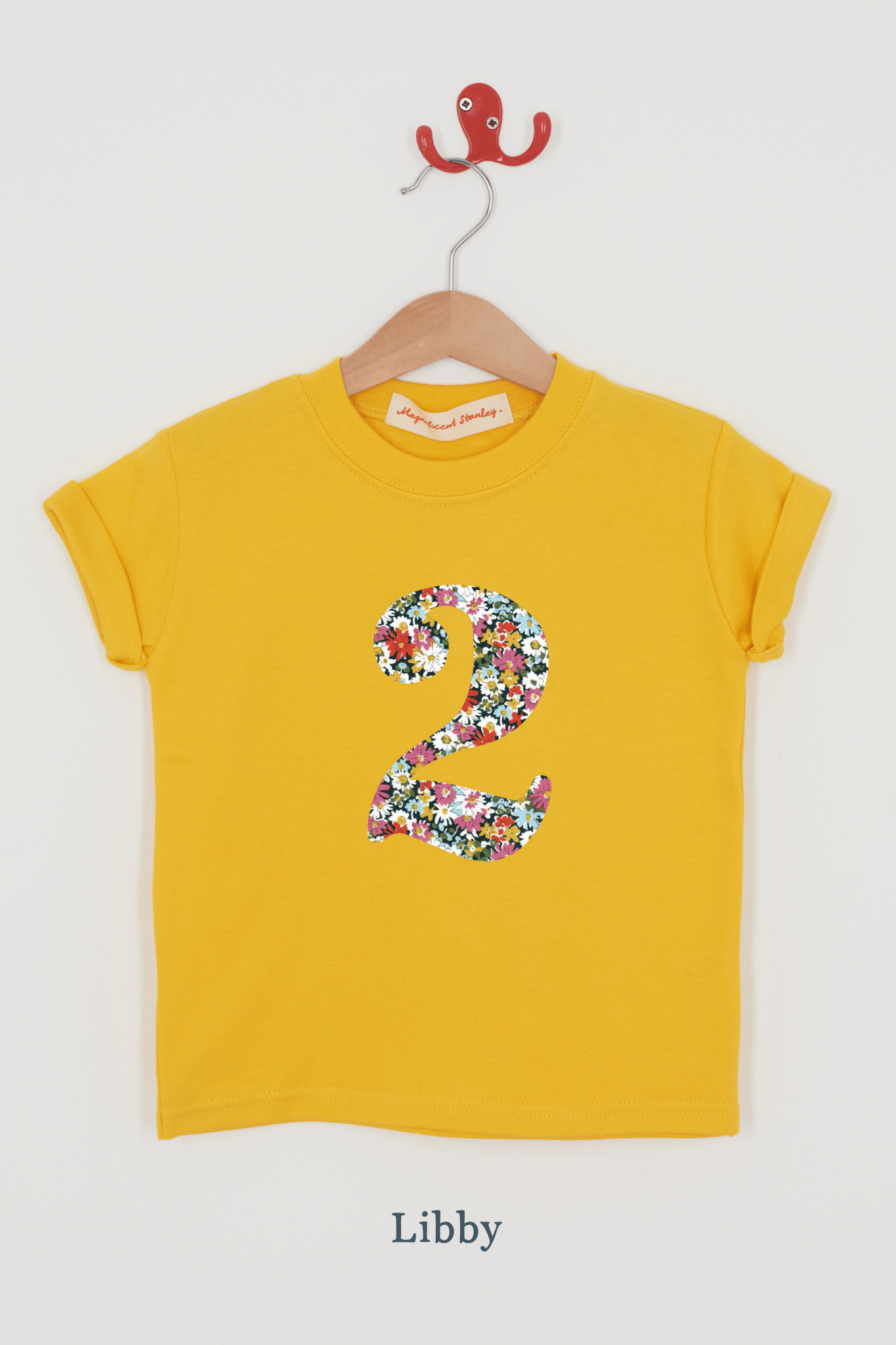 a yellow birthday t-shirt with a number 2 cut from libby liberty floral print on the front.