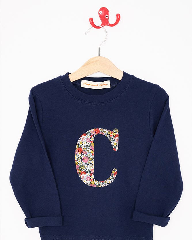 a navy cotton t-shirt with the letter 'c' on the front cut from libby floral liberty print