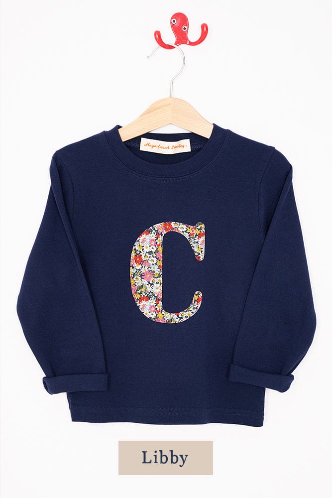 a navy cotton t-shirt with the letter 'c' on the front cut from libby floral liberty print