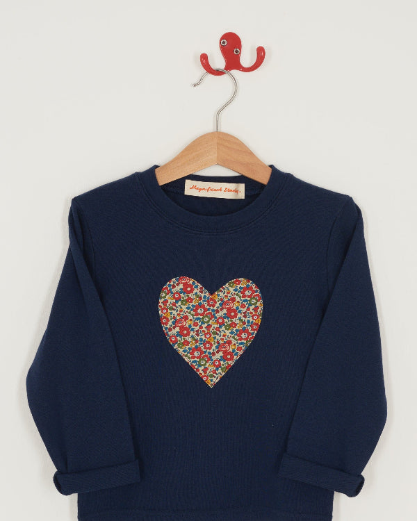 A navy cotton t-shirt with a Liberty floral heart sewn on the front.