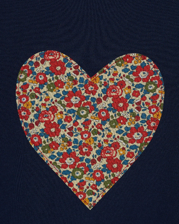 A navy cotton t-shirt with a Liberty floral heart sewn on the front.