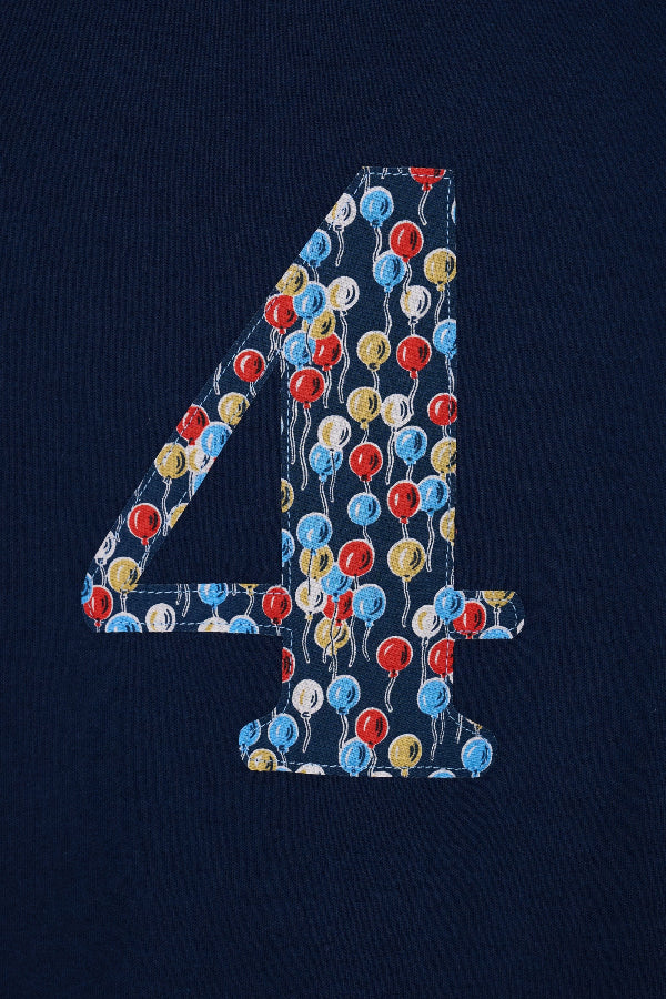 a close up of the stitching on a kids Number 4 cotton Navy birthday T-Shirt in Ethan's Party Liberty Print.