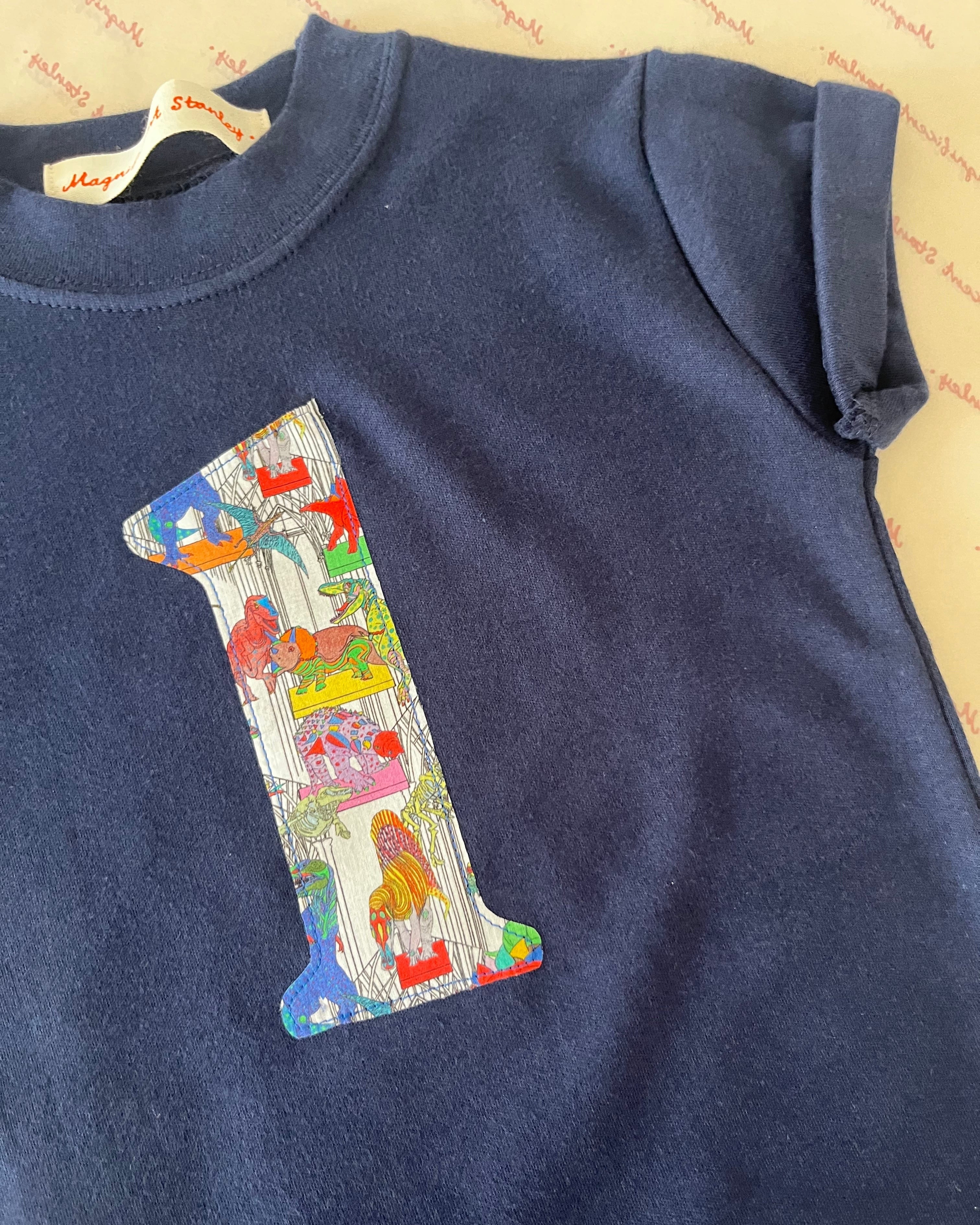 Magnificent Stanley Tee Personalised or Age Navy T-Shirt in Dinosaur Liberty Print