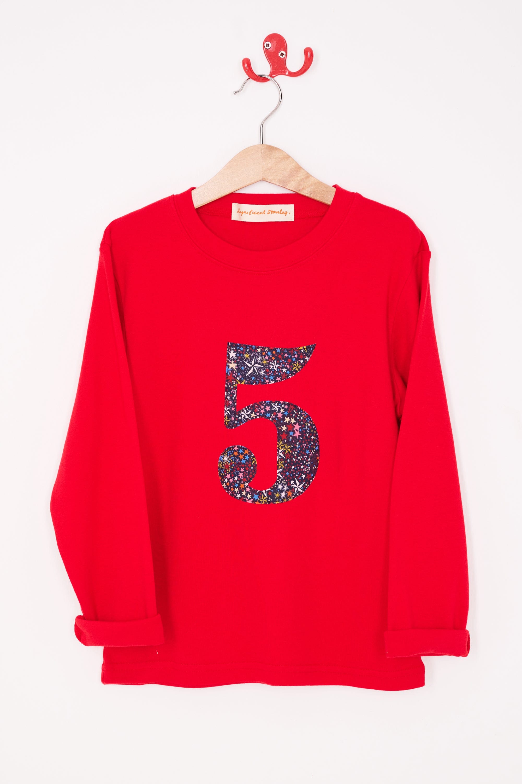 A red birthday t-shirt with the number 5 sewn onto it in Liberty Adelajda star print fabric.