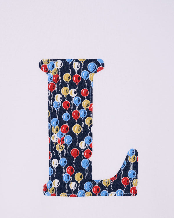 a personalised white cotton T-Shirt with an initial letter in Ethan's Party balloon Liberty Print.