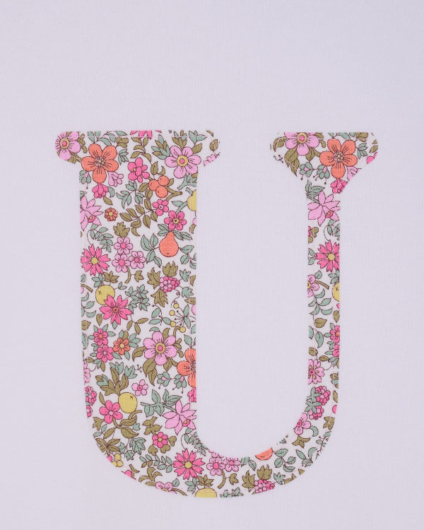 a personalised white cotton T-Shirt with her initial letter on the front in Fruit Punch Liberty Print.