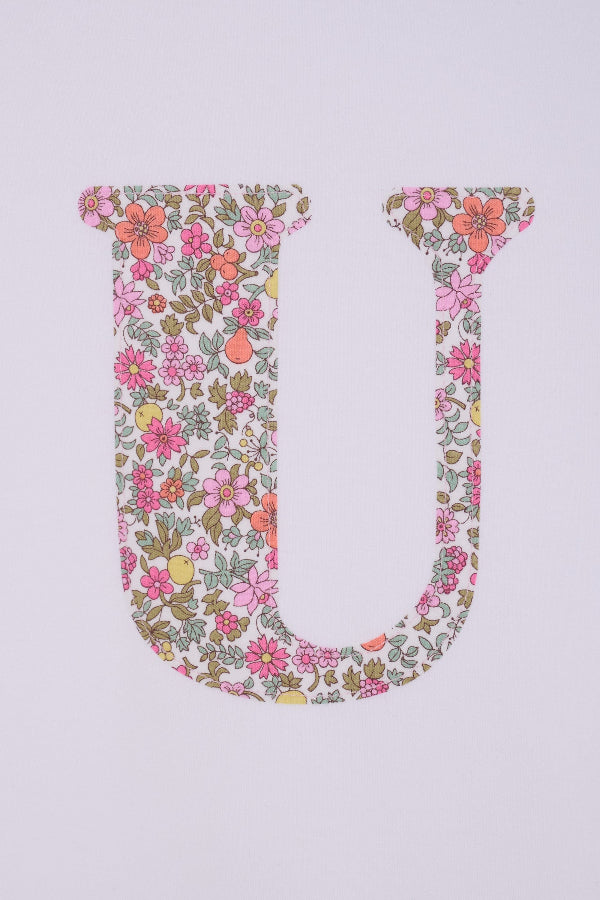 a personalised white cotton T-Shirt with her initial letter on the front in Fruit Punch Liberty Print.