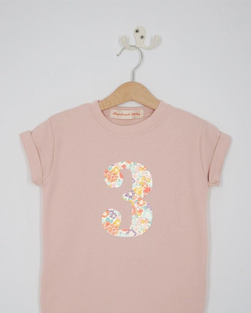 a pink 3rd birthday t-shirt with a number 3 cut from michelle liberty floral print on the front