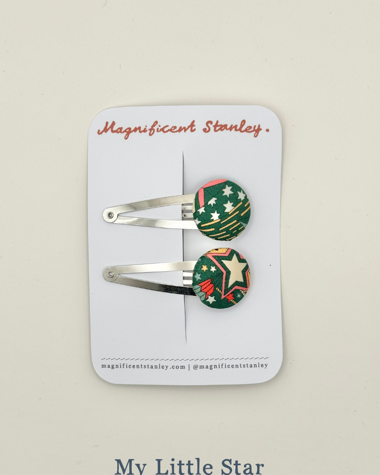 Two hair clips with liberty my little star design on a 'Magnificent Stanley' card.