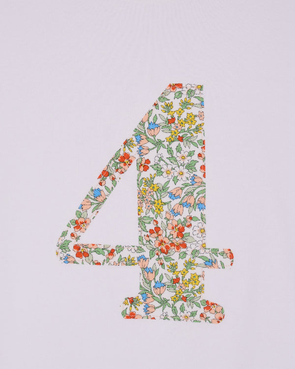 A white cotton birthday t-shirt with the number 4 sewn on the front cut from liberty Nazanin fabric