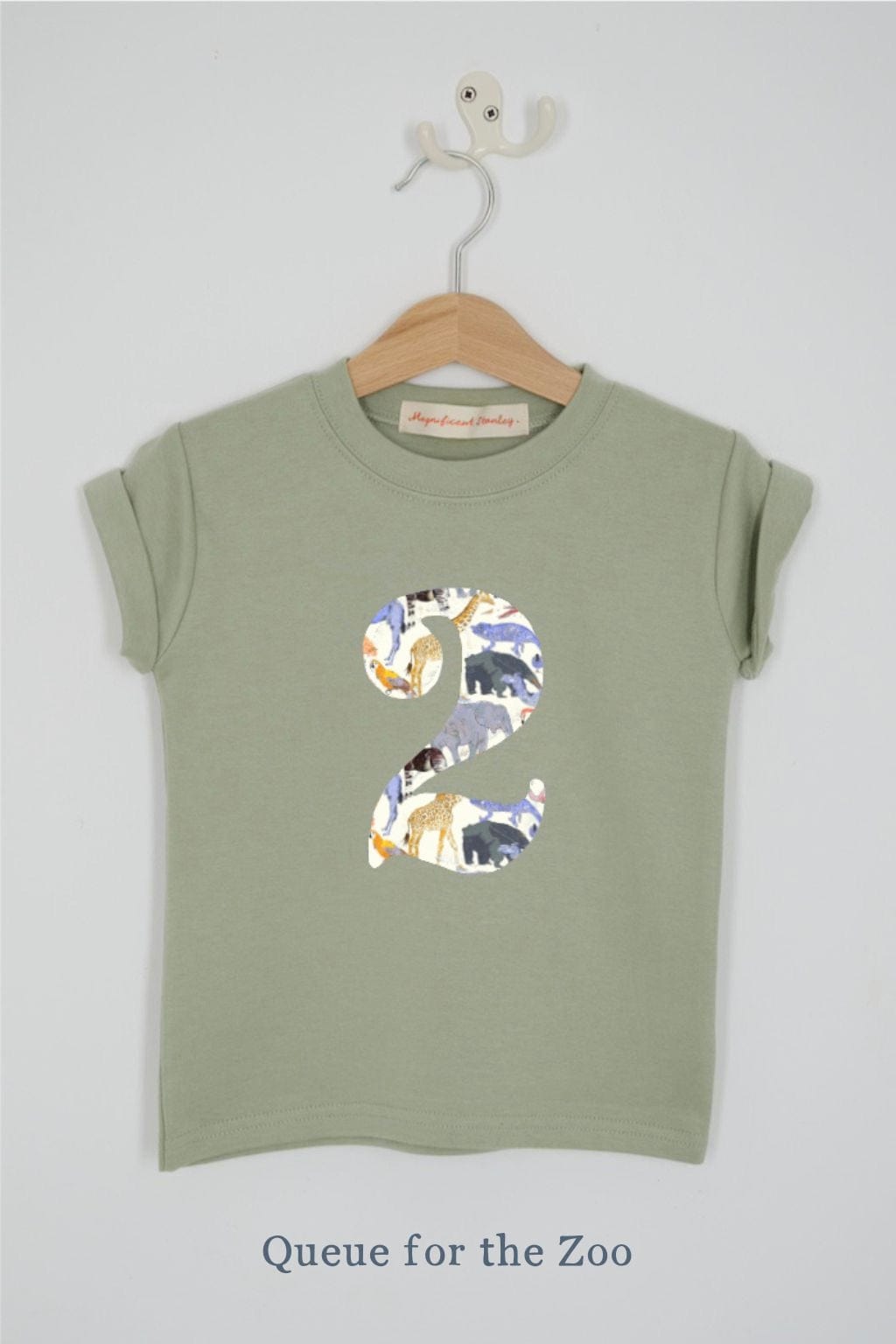 a number 2nd birthday kids sage green t-shirt with a number cut from queue for the zoo animal liberty print on the front.