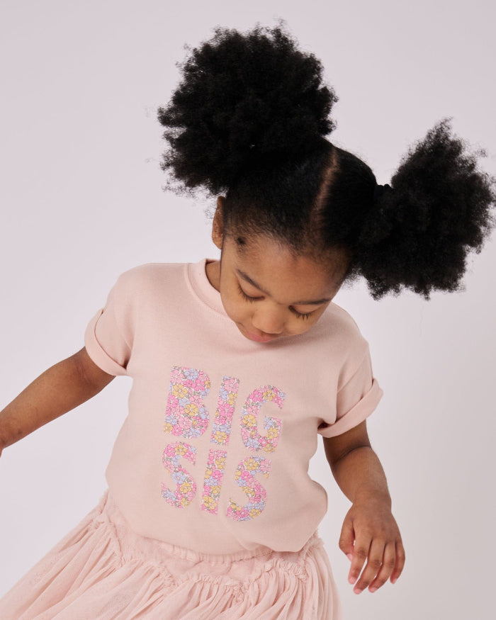 A girl wearing a BIG SIS pale Pink T-Shirt in Choice of Liberty Print as a proud big sister