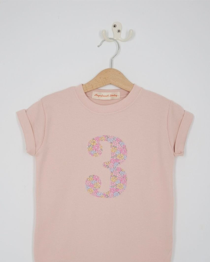 a pink 3rd birthday t-shirt with a number 3 cut from sadie rose liberty floral print on the front