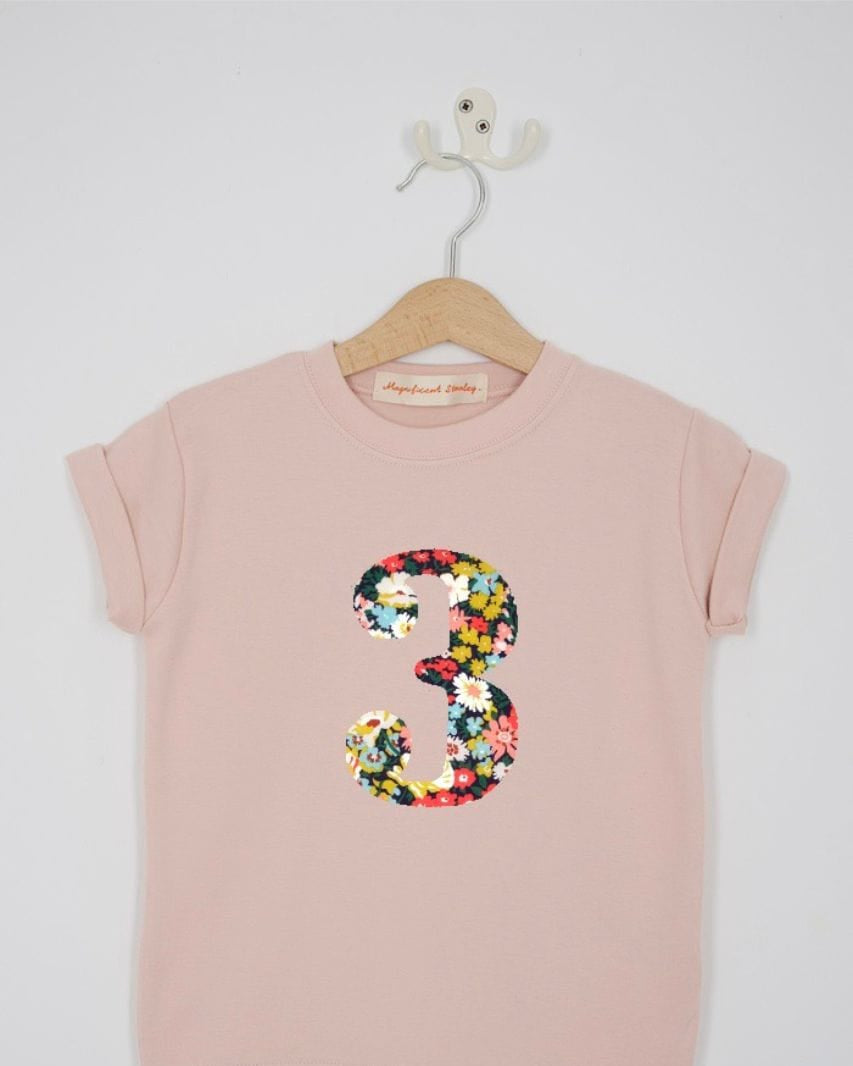 a pink 3rd birthday t-shirt with a number 3 cut from thorpe floral liberty print on the front