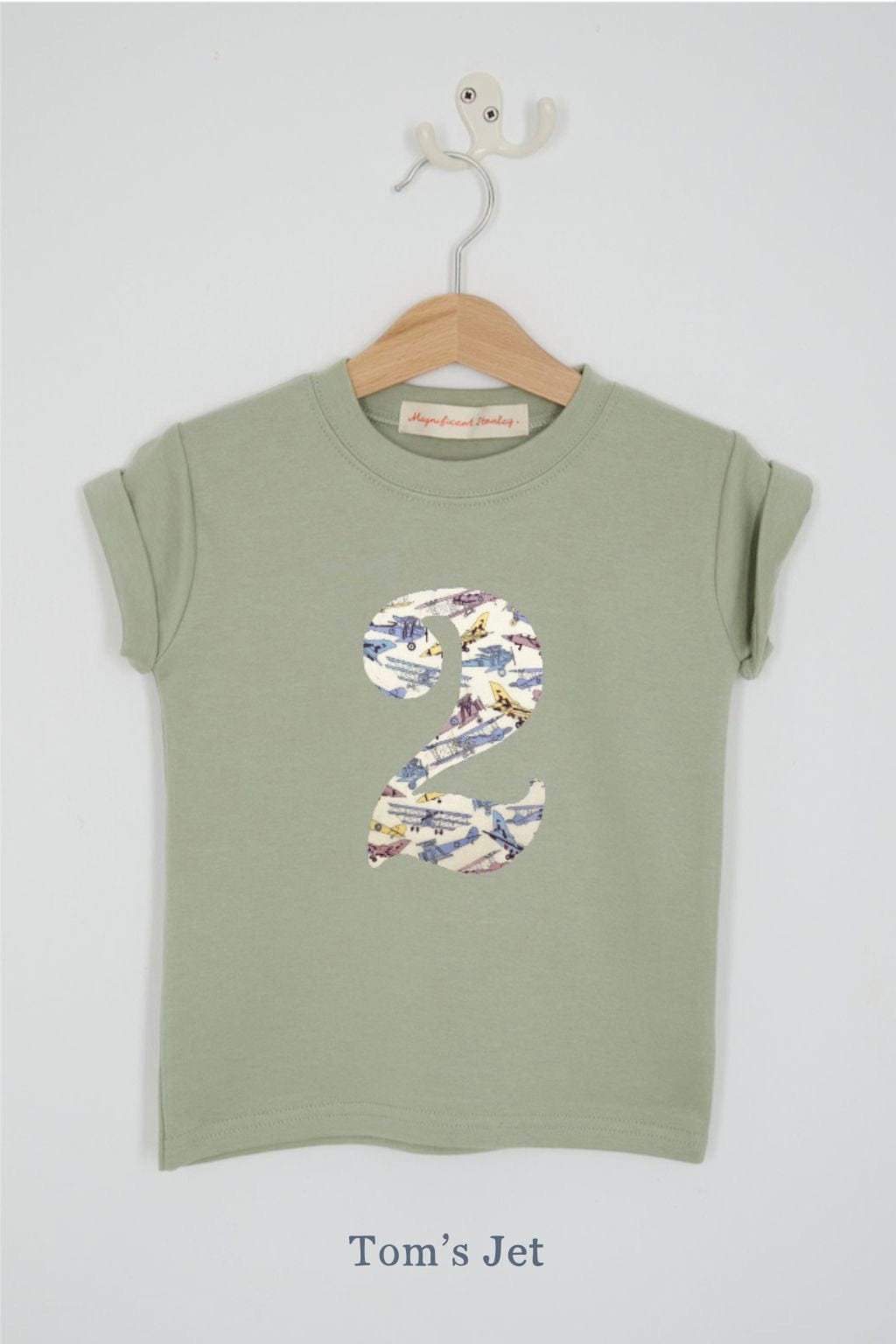 a number 2nd birthday kids sage green t-shirt with a number cut from tom's jet vintage plane liberty print on the front.
