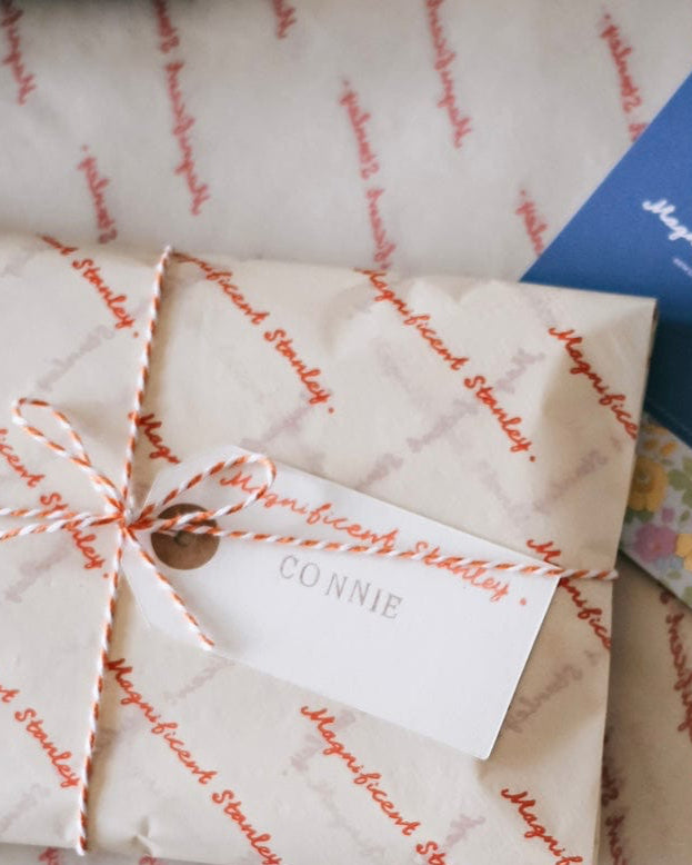 Magnificent Stanley Gift wrapped in logo tissue and twine with a hand stamped name tag