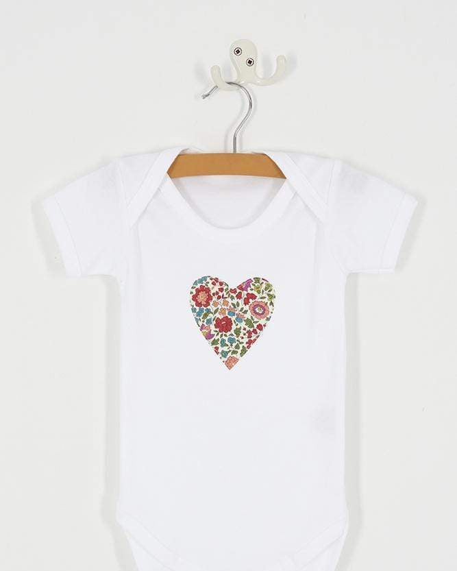 a bodysuit with a heart on made from d'anjo liberty print fabric