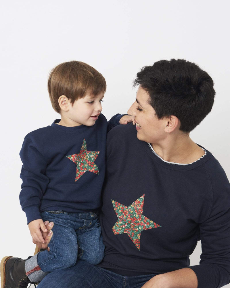 A Magnificent Stanley Ladies navy Christmas jumper with a festive Star in Wiltshire Liberty Print sewn on the front matching with her son