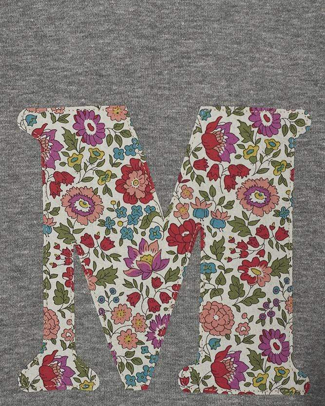 A personalised grey sweatshirt with an initial on in floral Liberty fabric.