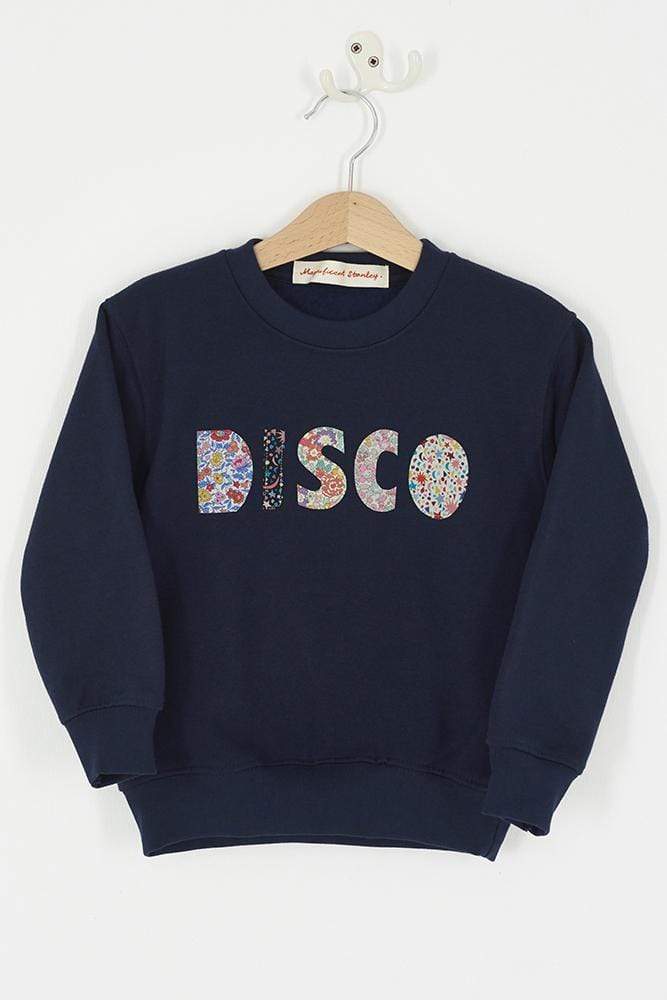 a Magnificent Stanley navy sweatshirt with the word DISCO Mixed Liberty Print sewn onto the front