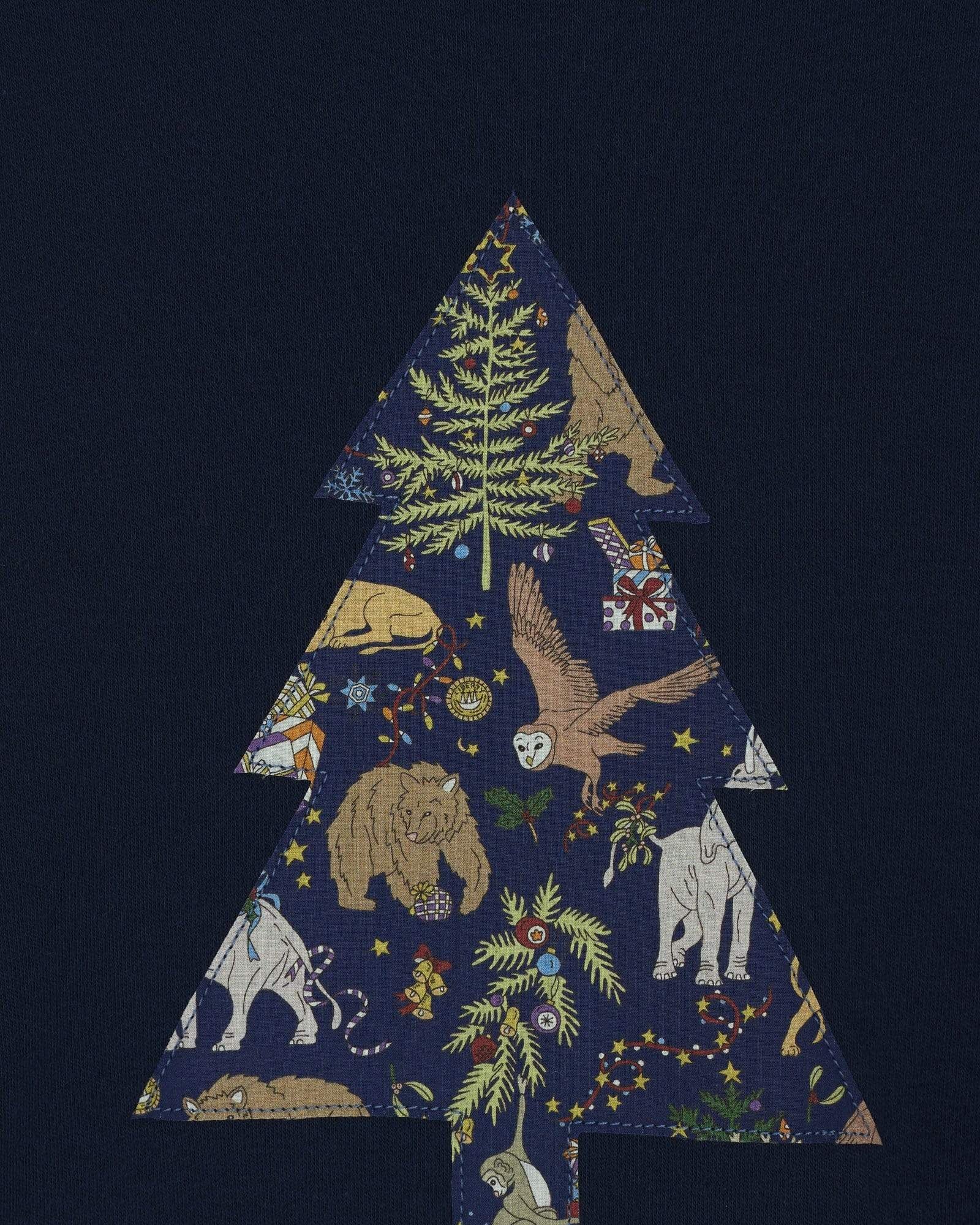 A navy long sleeve Christmas t-shirt with a Christmas Tree on the front made from Liberty Christmas print .