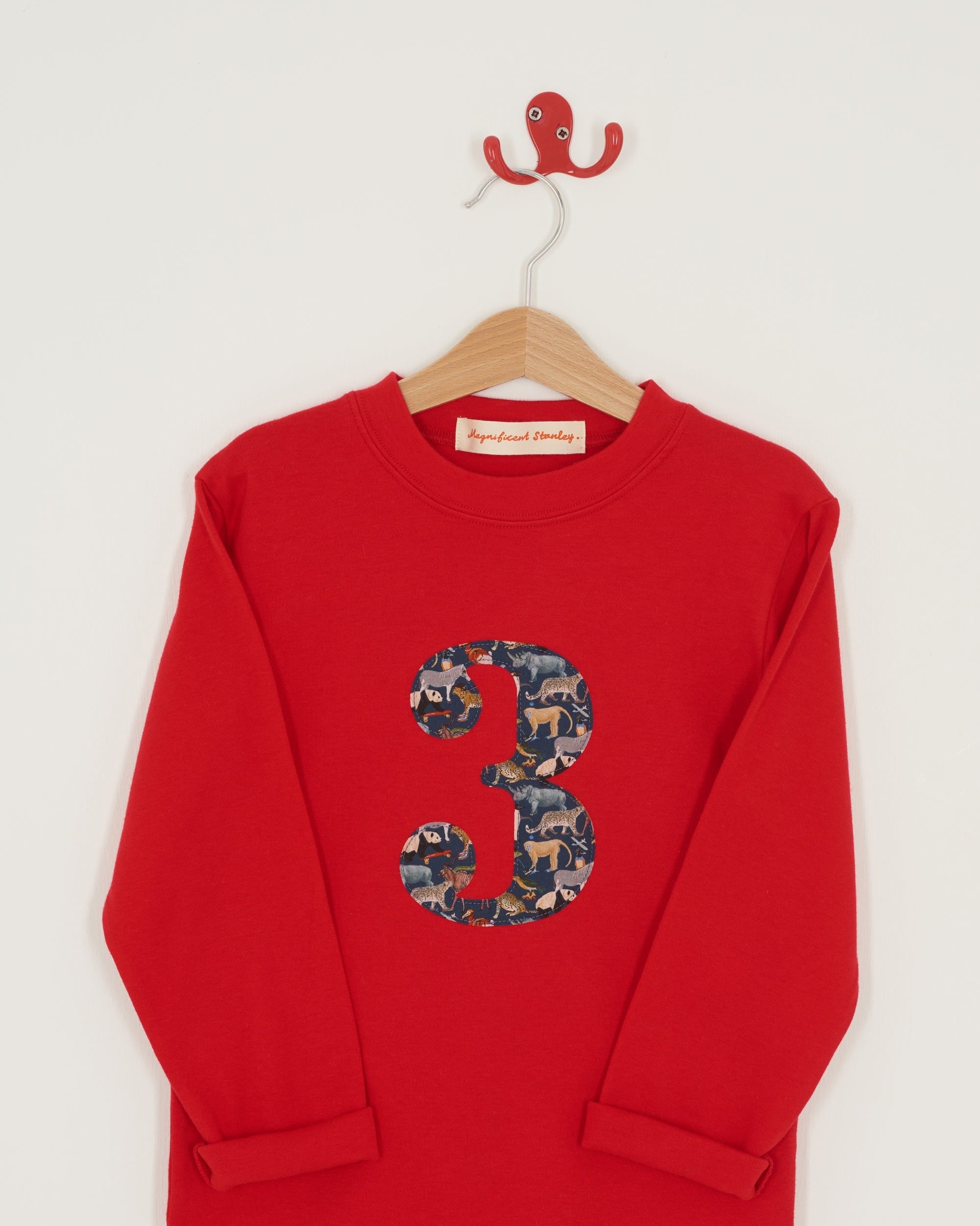 A red birthday t-shirt with a number 3 on the front made from Liberty zoo print fabric.