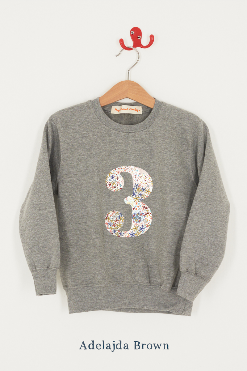 A birthday grey sweatshirt with a number 3 on in Adelajda Liberty fabric.