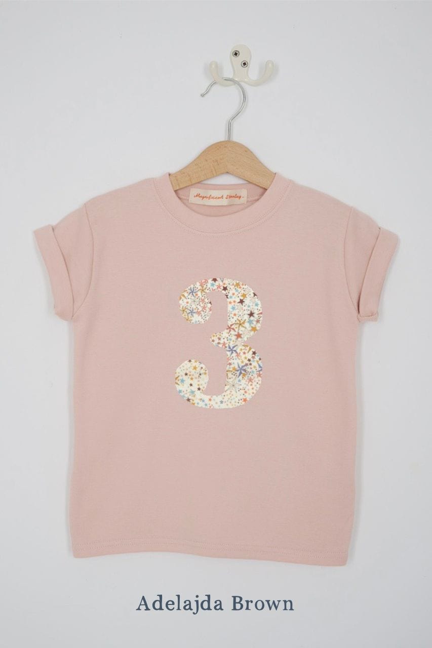 a pink birthday t-shirt with a number 3 cut from adelajda brown liberty floral print on the front