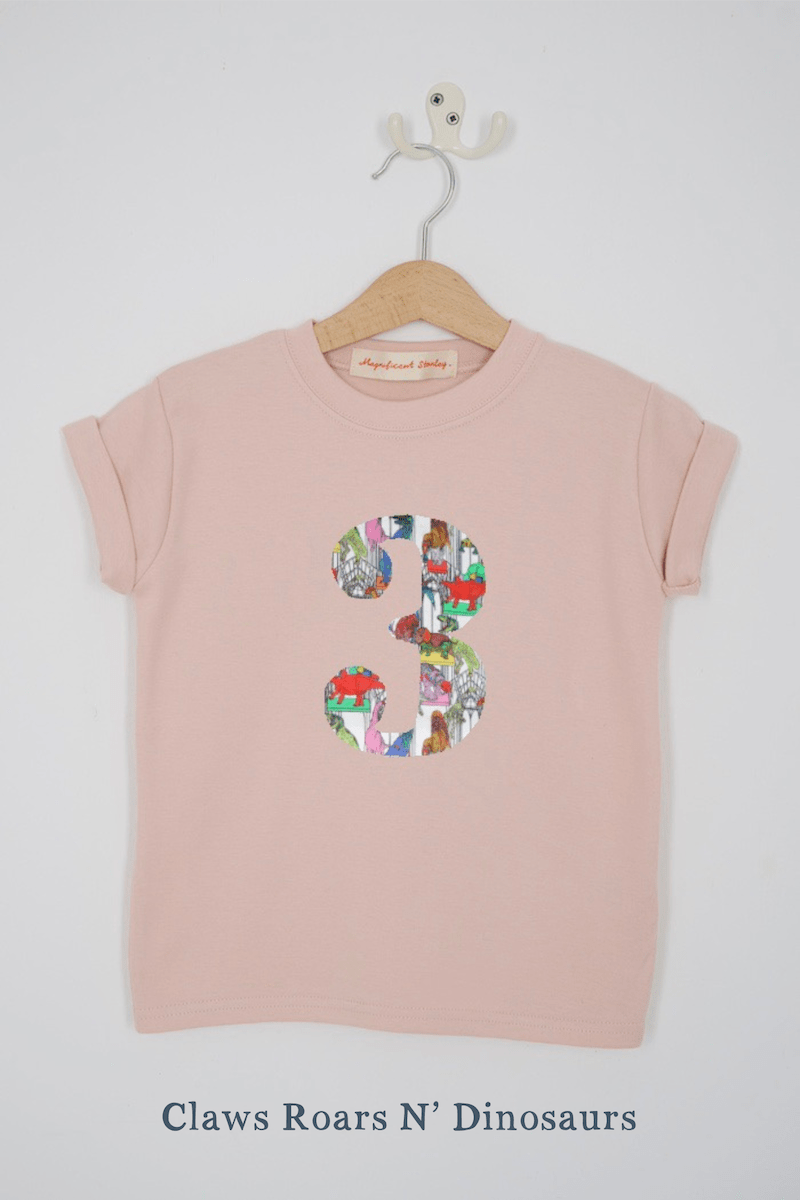 a pink birthday t-shirt with a number 3 cut from dinosaur liberty floral print on the front
