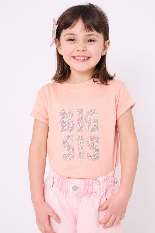 A girl wearing a BIG SIS pale Pink T-Shirt in Choice of Liberty Print as a proud big sister