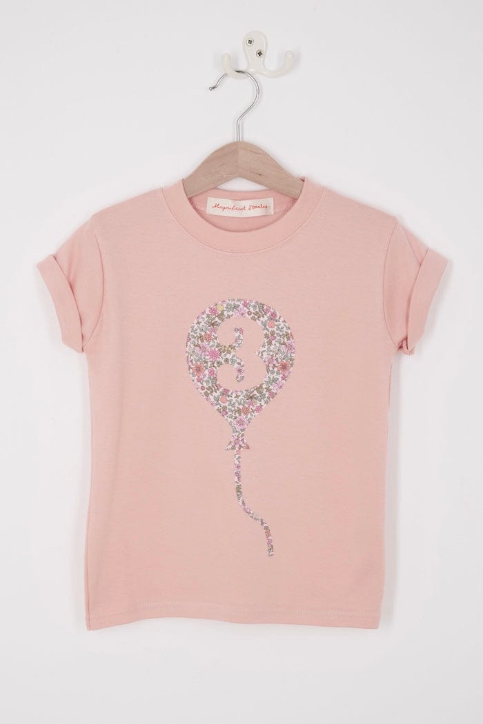 a pink birthday t-shirt with a balloon with the number 3 on it cut from floral Liberty print.