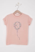 a pink birthday t-shirt with a balloon with the number 3 on it cut from floral Liberty print.