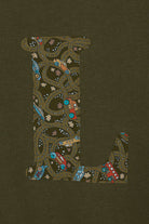 A khaki sweatshirt with an initial on the front. The initial is made from vintage cars Liberty print.
