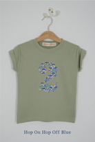 a number 2nd birthday kids sage green t-shirt with a number cut from hop on hop off cars liberty print on the front.