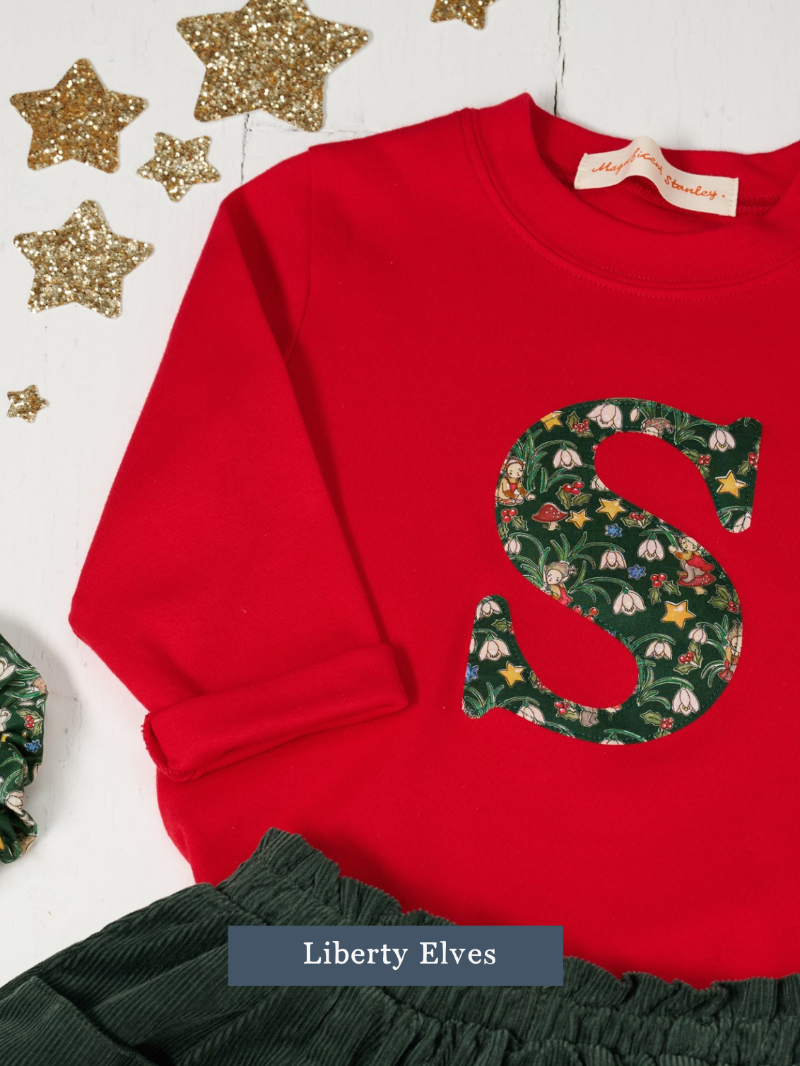 a Magnificent Stanley long sleeve Red birthday T-Shirt with the number 2 on the front in Liberty Christmas Elves print 