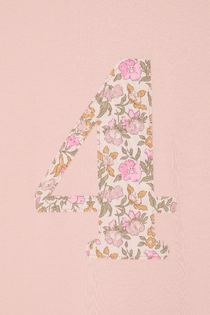 a pale pink t-shirt with the number 4 sewn on the front cut from liberty floral Mamie print.