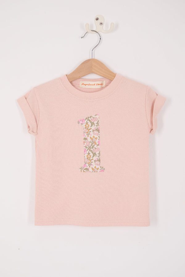 a pale pink t-shirt with the number 1 sewn on the front cut from liberty floral Mamie print.