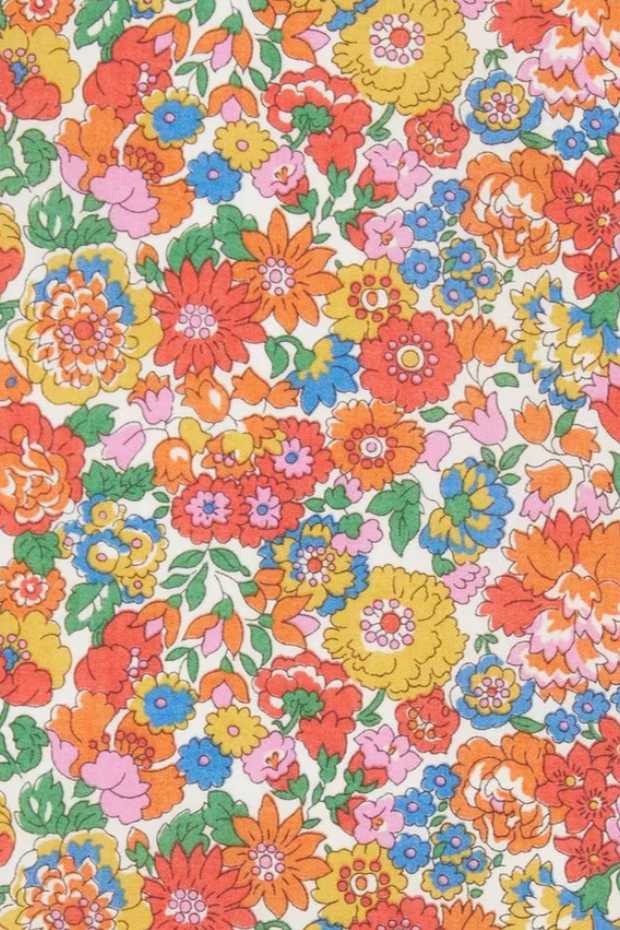 A swatch of classic Nell Annie and May Liberty print tana lawn featuring bright spring flowers