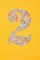 a yellow birthday t-shirt with a number 2 cut from liberty floral print on the front
