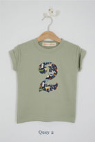 a number 2nd birthday kids sage green t-shirt with a number cut from quey 2 animal liberty print on the front.