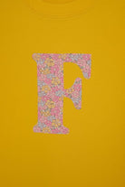 Magnificent Stanley kids personalised initial yellow T-Shirt in sadie rose Liberty Print