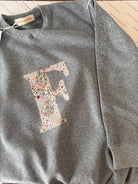 Grey sweatshirt with initial in star fabric