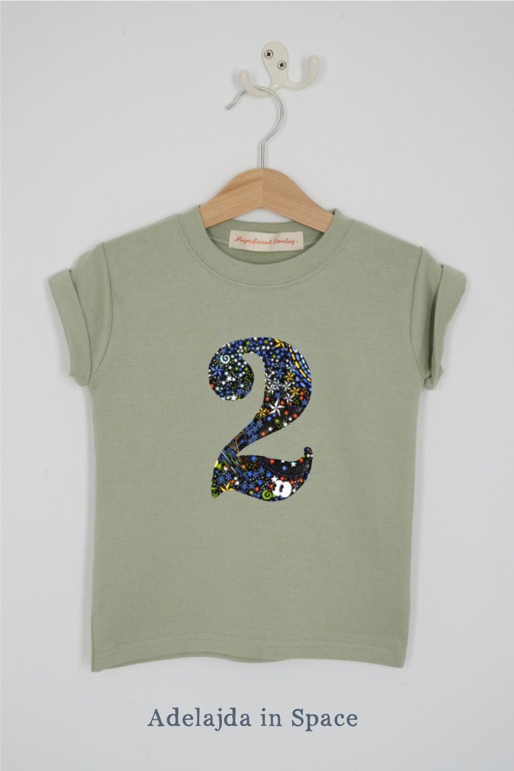 a birthday number 2 kids sage green t-shirt with a number cut from adelaide in space liberty print on the front.