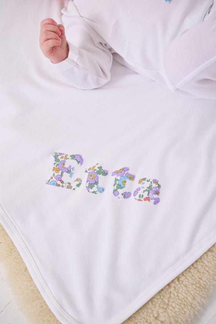 Personalised baby blanket new baby gift with name on in Betsy Purple liberty print.