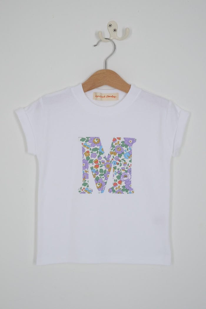 a white cotton short sleeve t-shirt with the number 3 hand-appliqued in a floral Betsy Liberty Print.