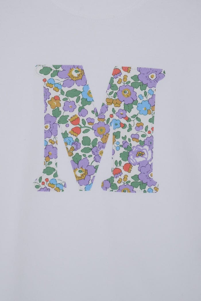 a white cotton short sleeve t-shirt with the number 3 hand-appliqued in a floral Betsy Liberty Print.