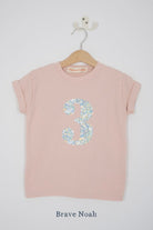 a pink 3rd birthday t-shirt with a number 3 cut from brave noah dragon print on the front