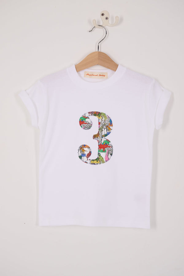A white kids T-Shirt with a number 3 on the front in Dinosaur Liberty Print