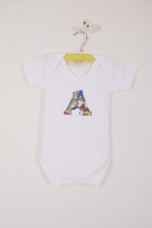a personalised baby bodysuit with his initial cut from dinosaur liberty print on the front