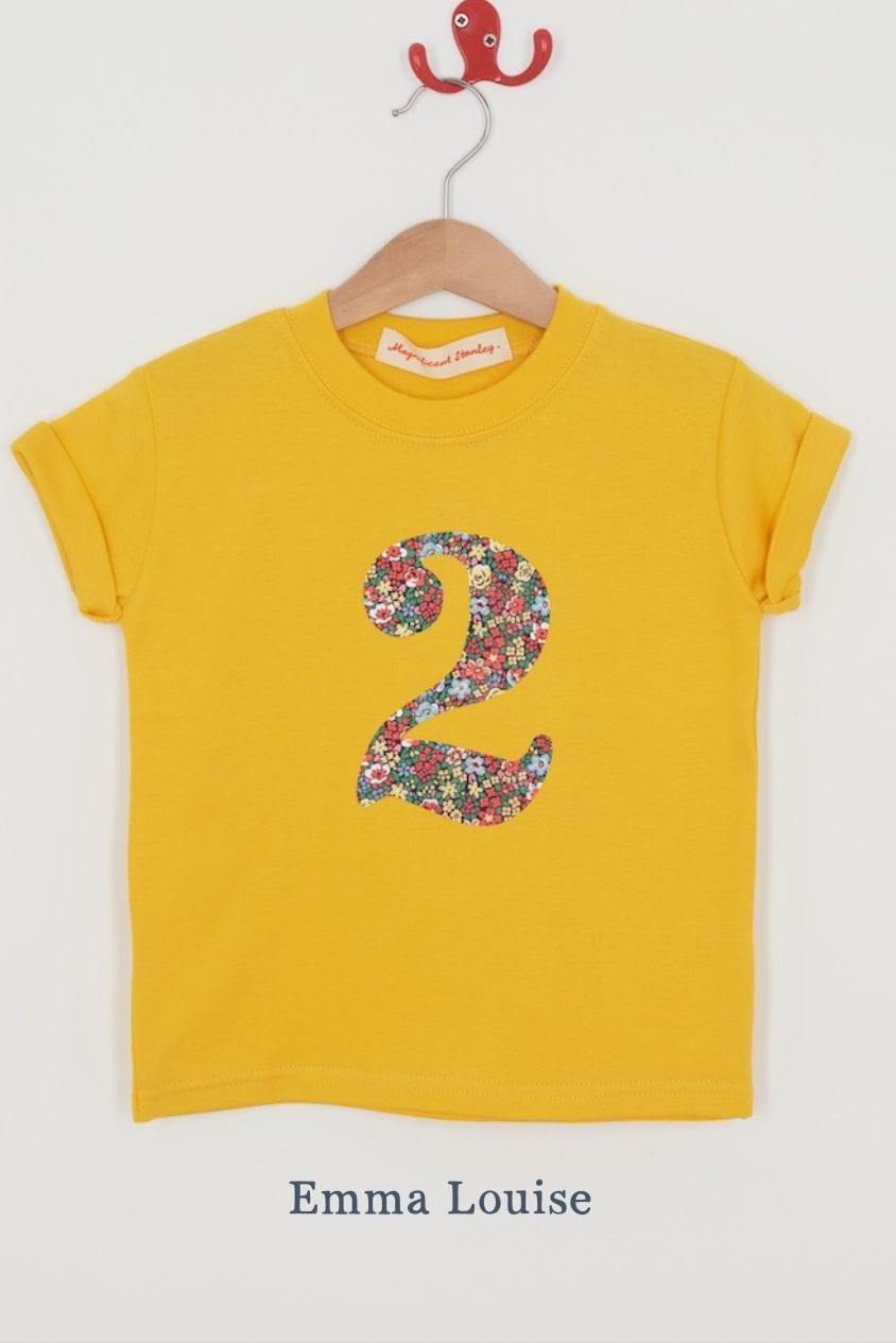 a yellow birthday t-shirt with a number 2 cut from emma louise liberty floral print on the front.